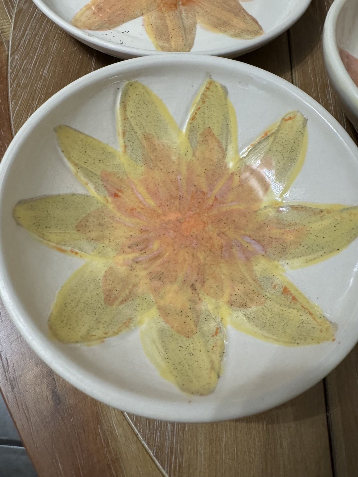Hand decorated ceramic plate with flower design